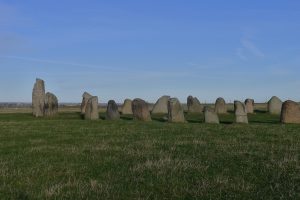 The weathered granite blocks under a wide Skåne sky