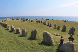 The oval of standing stones stretching along the ridge