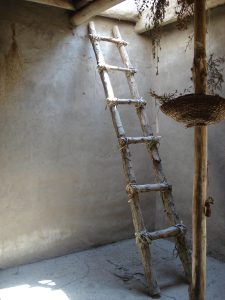 A reconstructed ladder giving access through the roof, the way people entered these homes