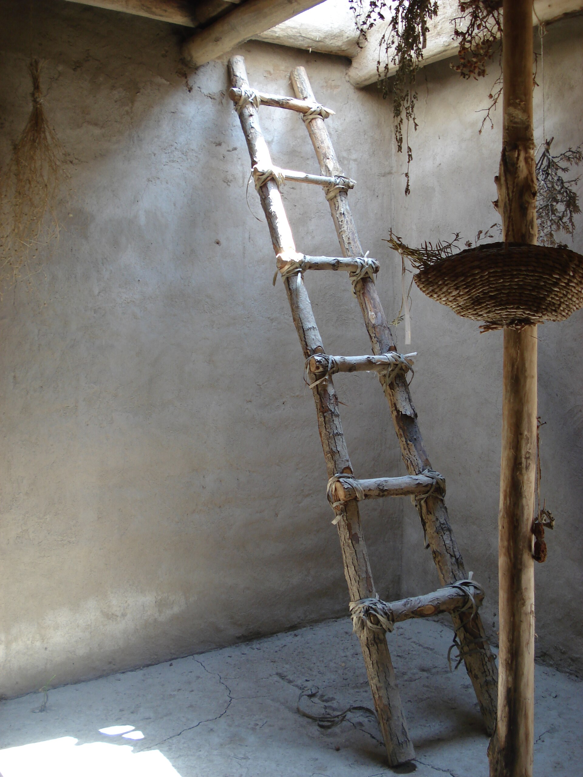 A reconstructed roof ladder, the everyday means of climbing down into a home through its ceiling.