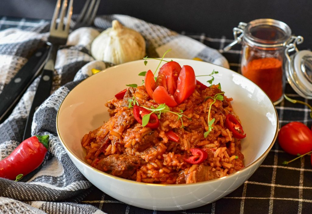 Slow-cooked meat, rice, and bread anchor the Baloch table.