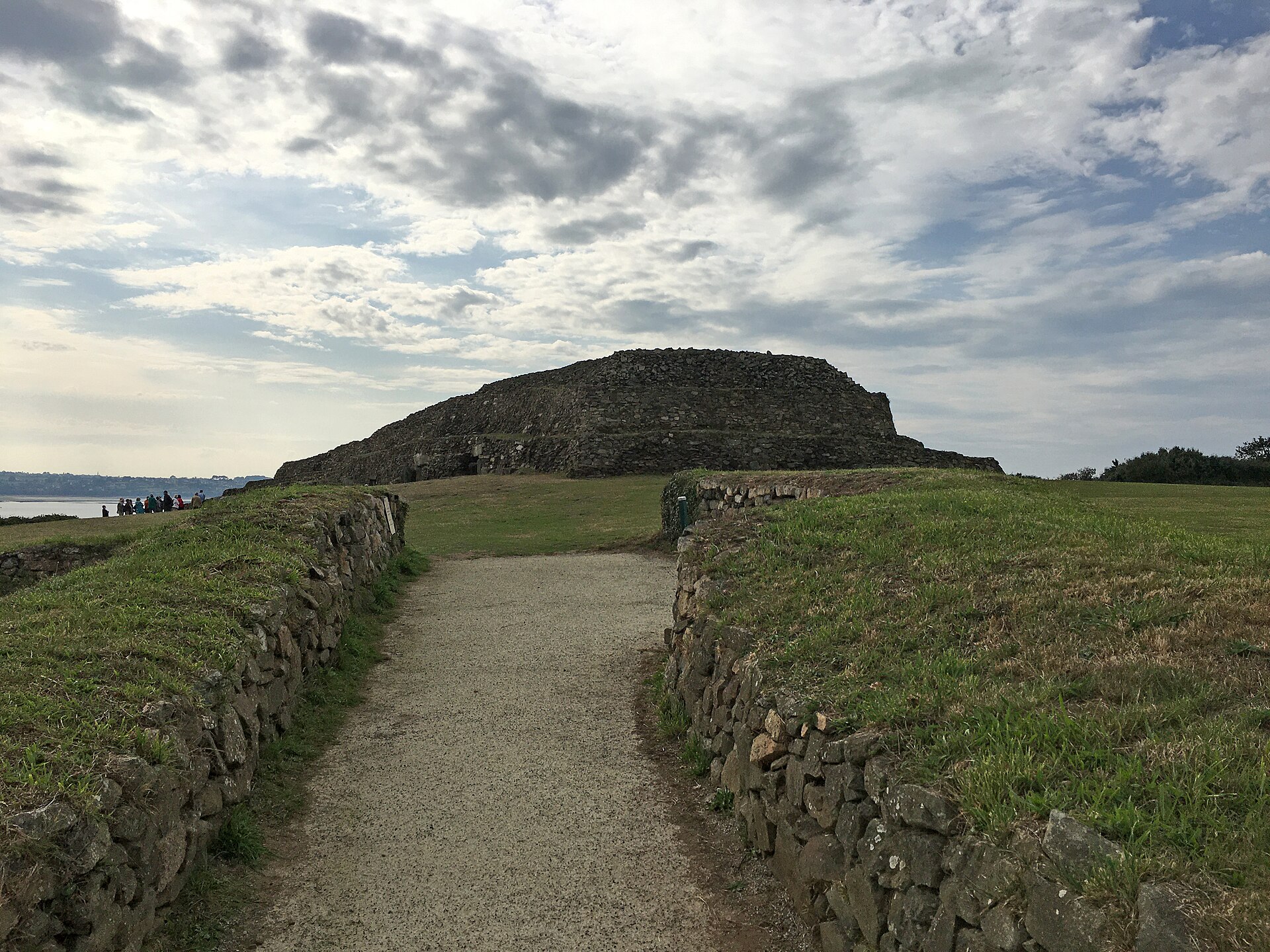 A modern overview of the Cairn of Barnenez in its coastal Breton setting