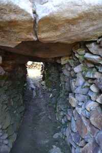 A stone-lined passage entrance leading into a chamber at Barnenez