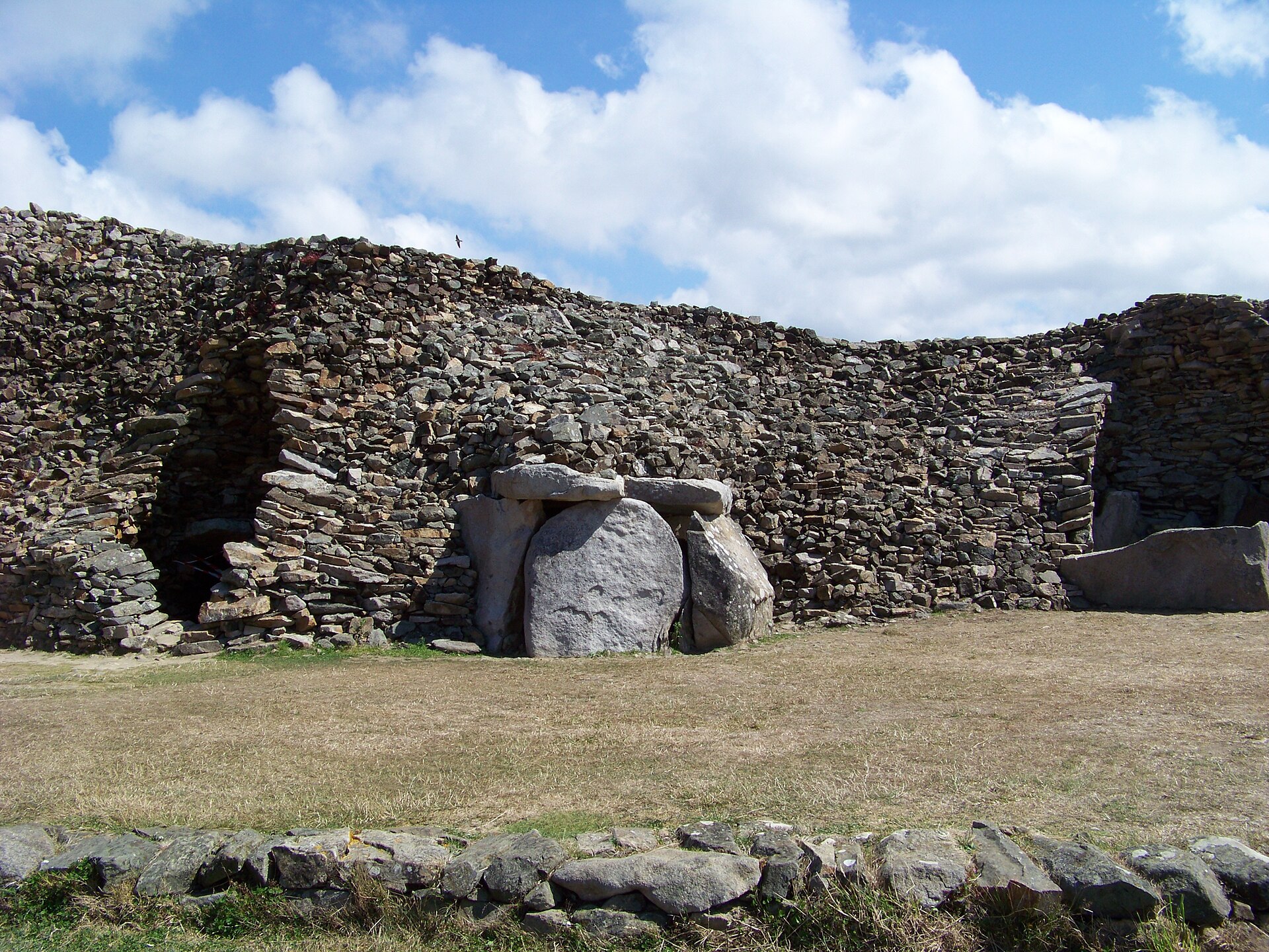A corbelled inner burial chamber of the Barnenez cairn, its walls stepping inward to form a vault