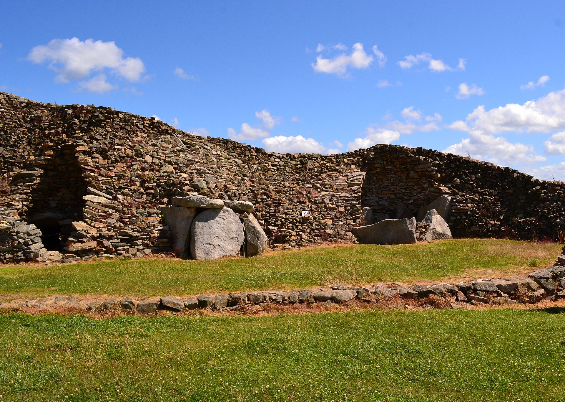 The quarried cross-section of Barnenez, where 20th-century stone-robbing sliced open the chambers