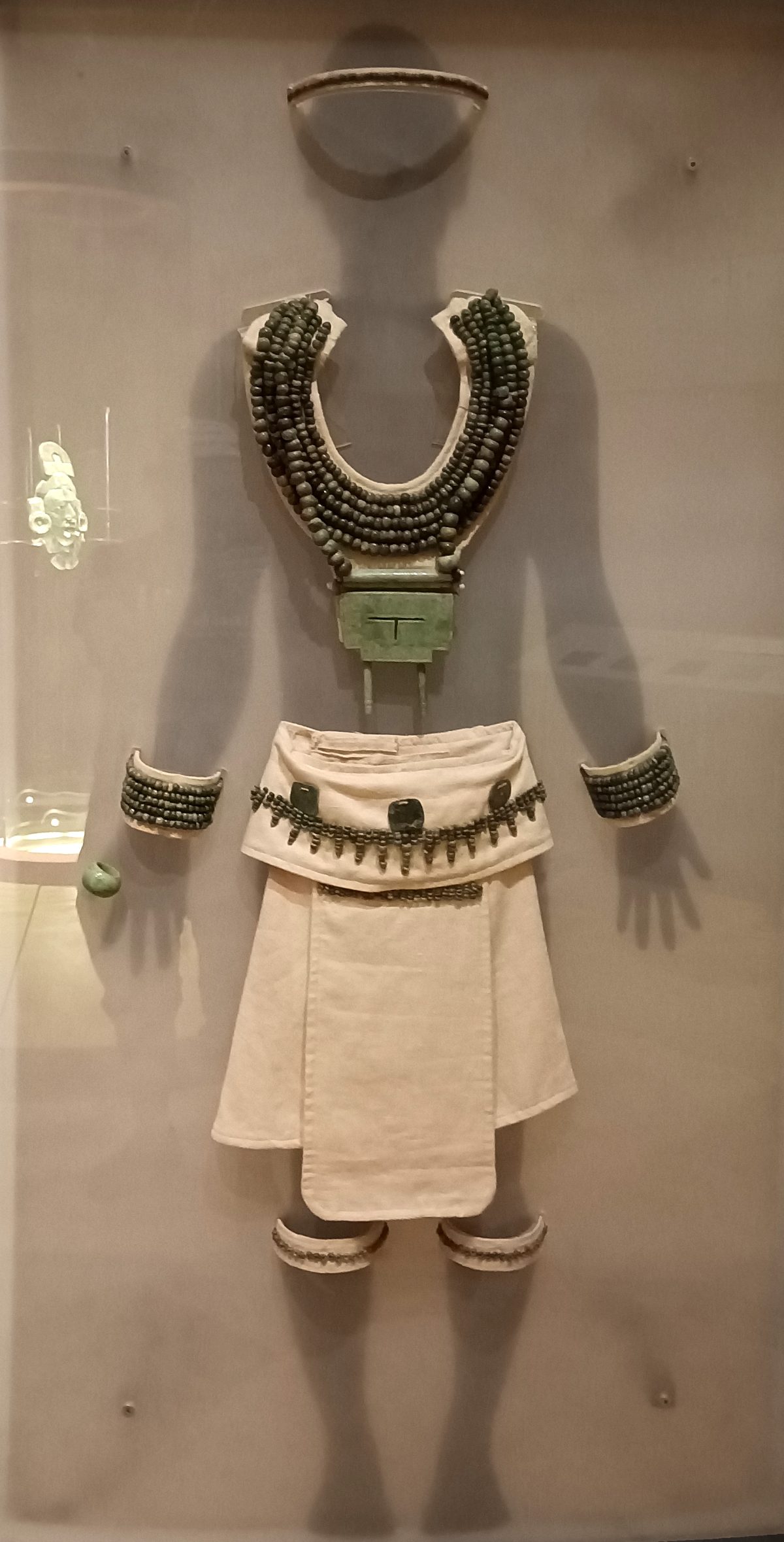 Funerary offerings recovered from a royal tomb at Calakmul displayed in a museum