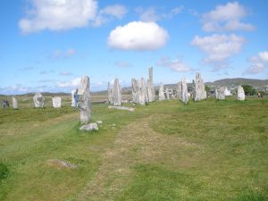 Standing stones silhouetted at the edge of the moor