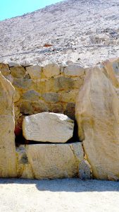 A carved standing figure on a Cerro Sechin monolith