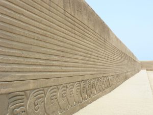 Carved adobe frieze wall at the Tschudi Palace in Chan Chan