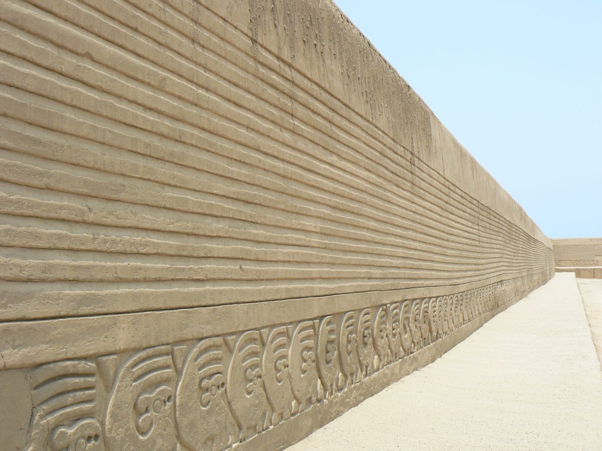 Carved adobe frieze wall at the Tschudi Palace in Chan Chan