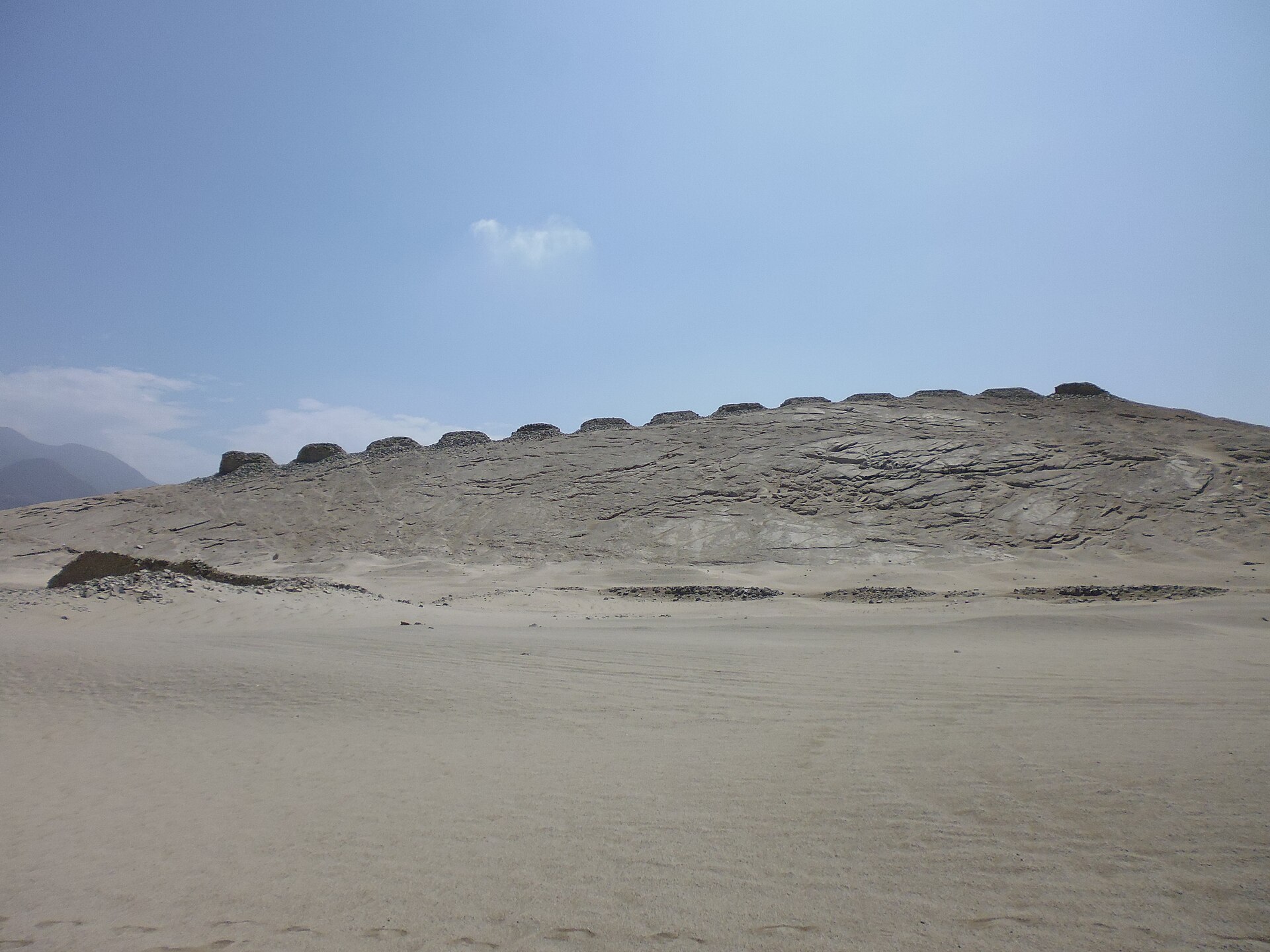 The row of thirteen towers, spaced along the ridge to divide the sun’s yearly journey into readable segments.