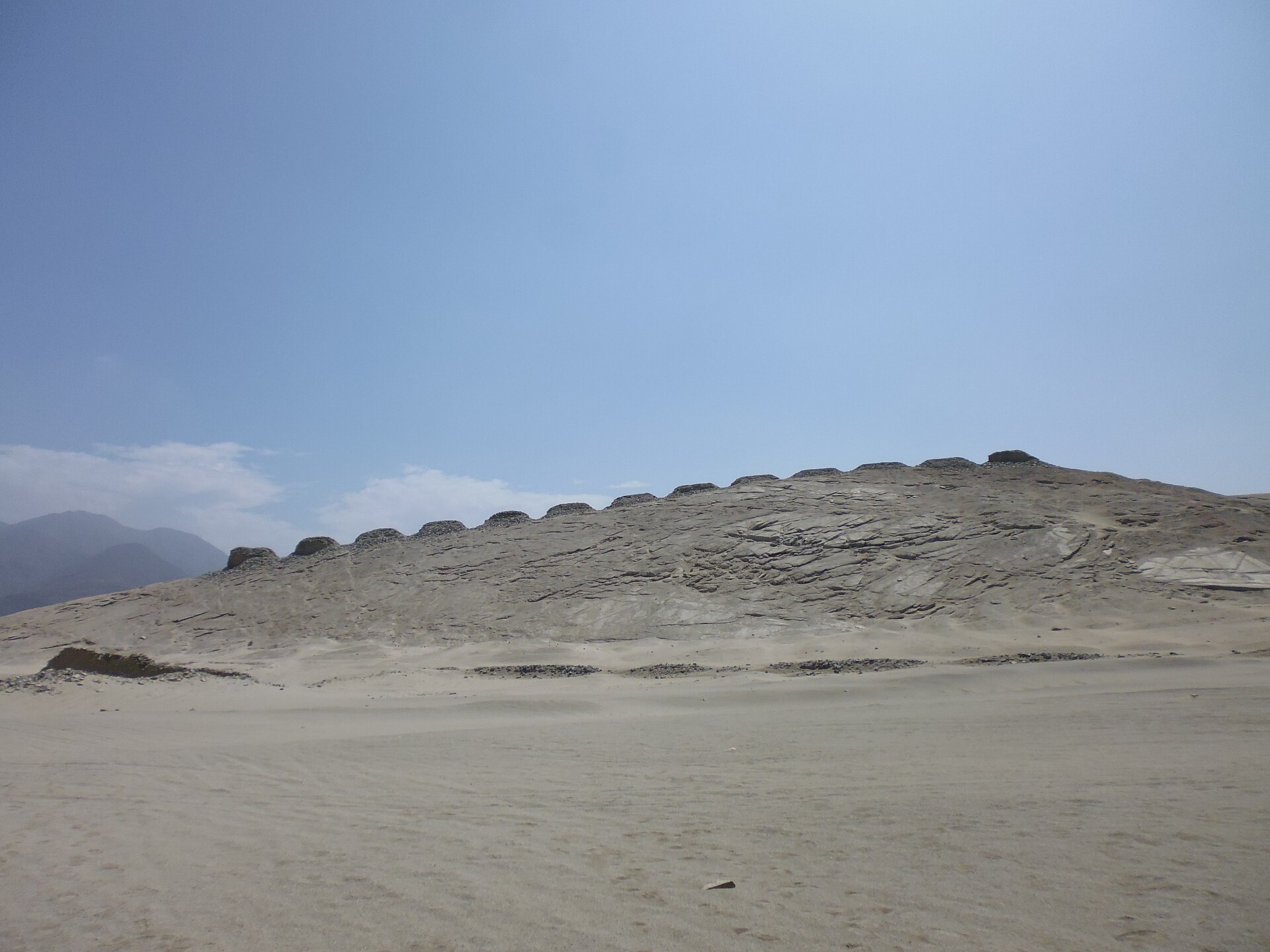 The Thirteen Towers of Chankillo march along a ridge in the Peruvian desert, forming the oldest known solar observatory in the Americas.