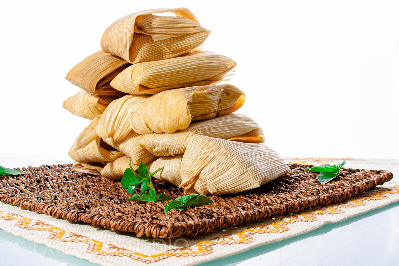 Steamed tamales wrapped in leaves