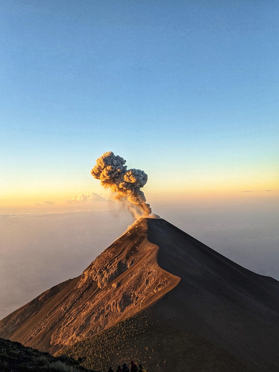 Volcanic peak rising above green nature