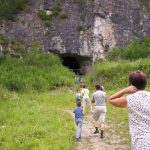 Tourists at the entrance to Denisova Cave, Russia