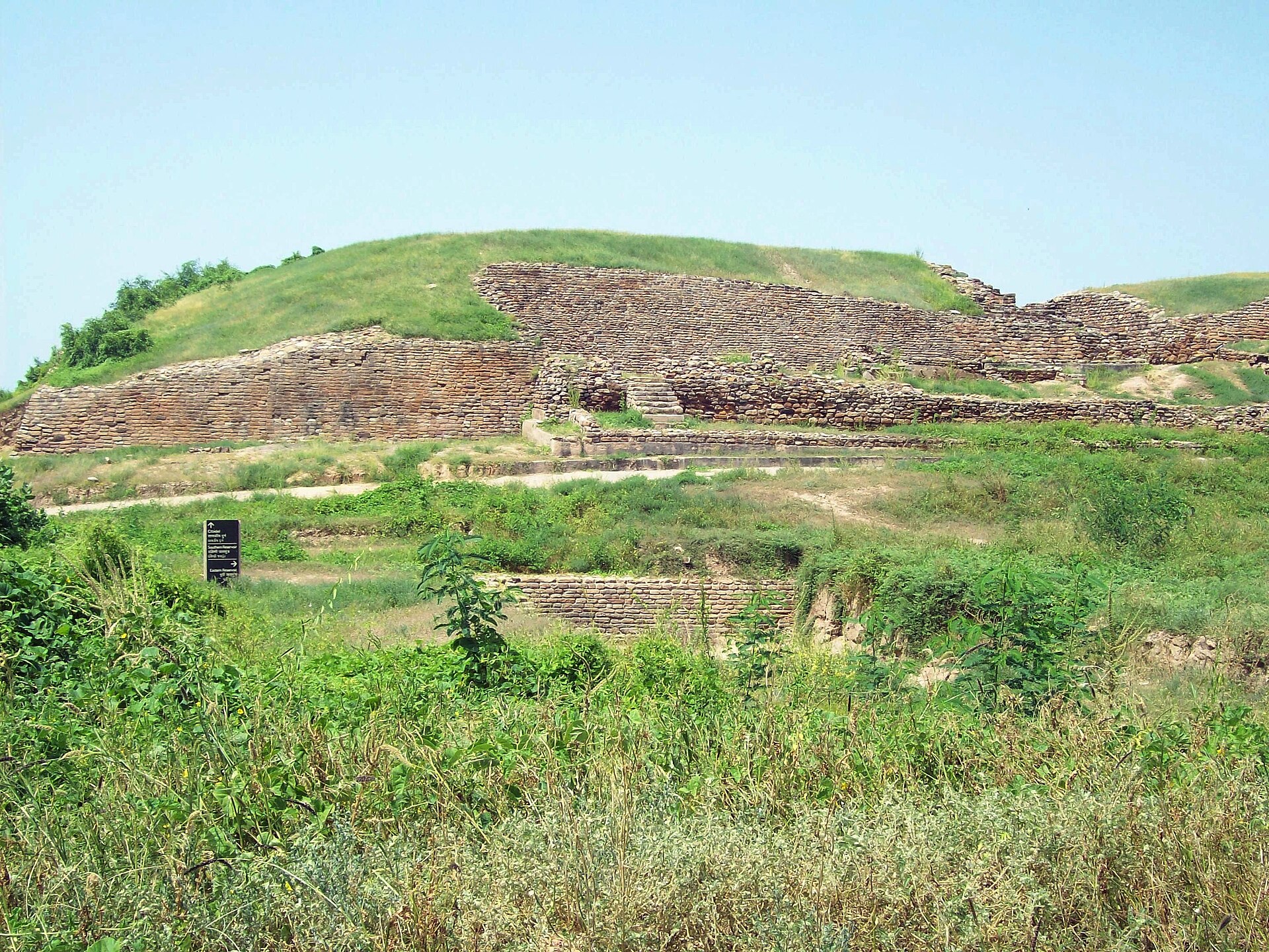 The mounds of Dholavira rising from the surrounding plain, all that remains of one of the great cities of the Indus Valley Civilization.