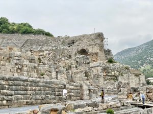 The great theatre seating rising above the ruins of Ephesus