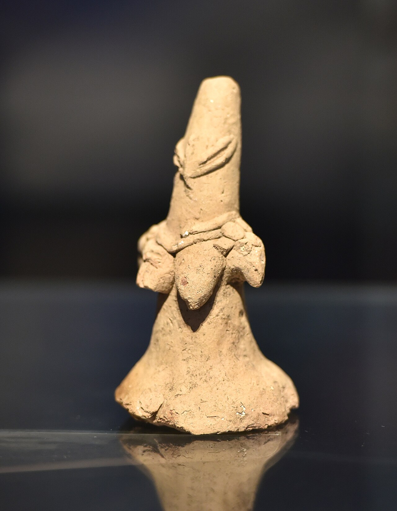 Terracotta figurine, a primitive representation of a woman. From Ur or Eridu, Iraq. 4000-3500 BCE. Iraq Museum, Baghdad.