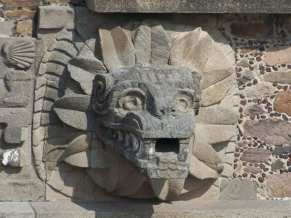 Carved feathered serpent head at the Temple of Quetzalcoatl in Teotihuacan