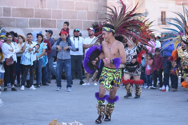 Feathered regalia and drumming turn village festivals into all-day public ceremonies.