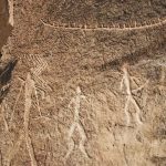 Ancient petroglyphs carved into rock at Gobustan
