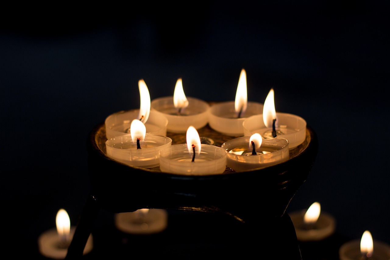 Prayer candles lit in devotion