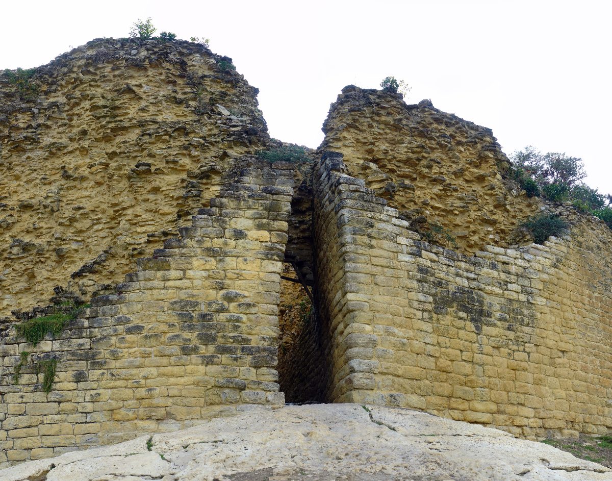 Round stone house foundations inside the walls of Kuelap