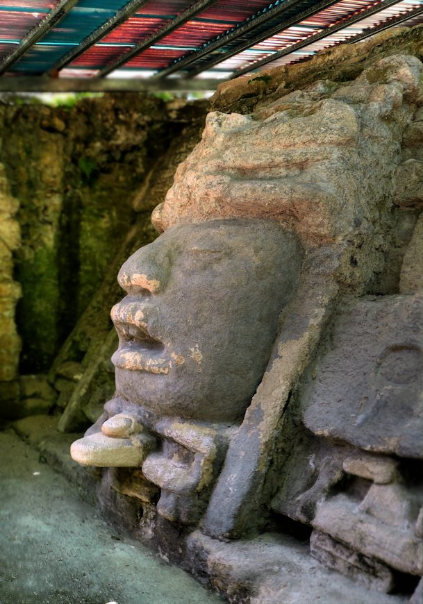 Carved stucco mosaic mask decorating a temple facade at Lamanai