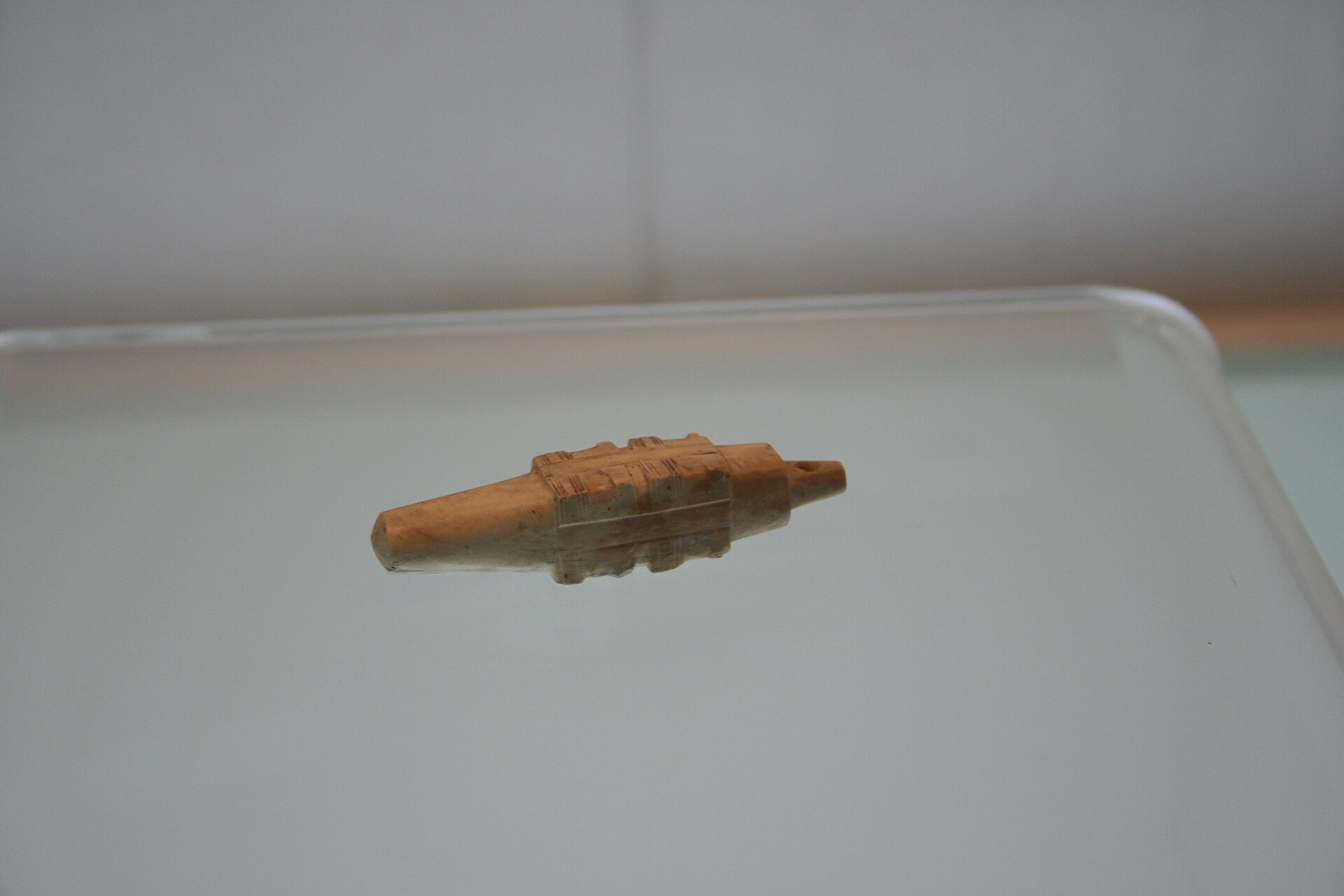 A Liangzhu jade cong, the kind of object buried with the honored dead before flood and time swallowed the civilization that made it.