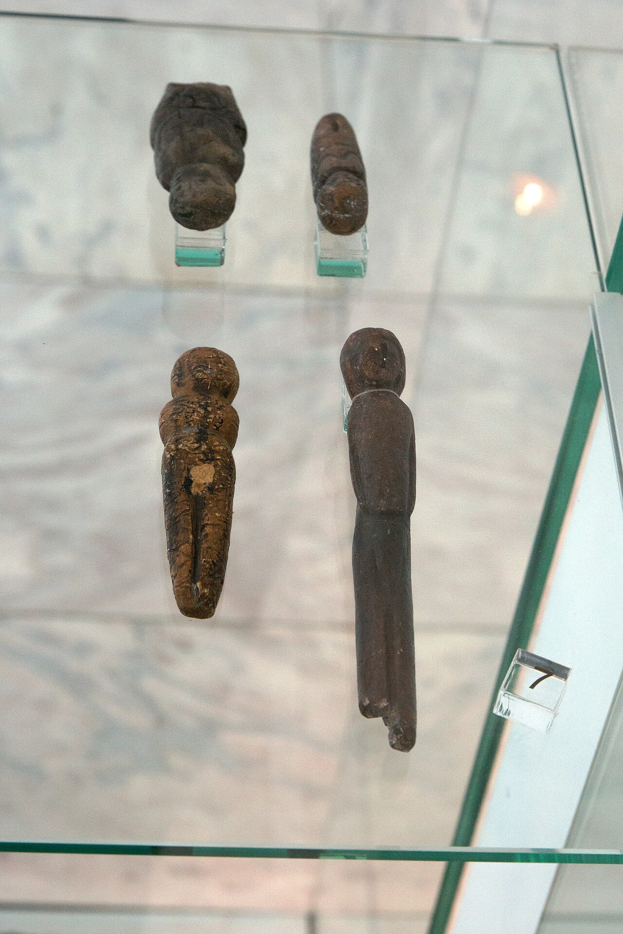 Upper Paleolithic art: (7) Figurines from Malta in Siberia, in suits with hood. Probably replicas. Anthropos Pavilon, Brno.