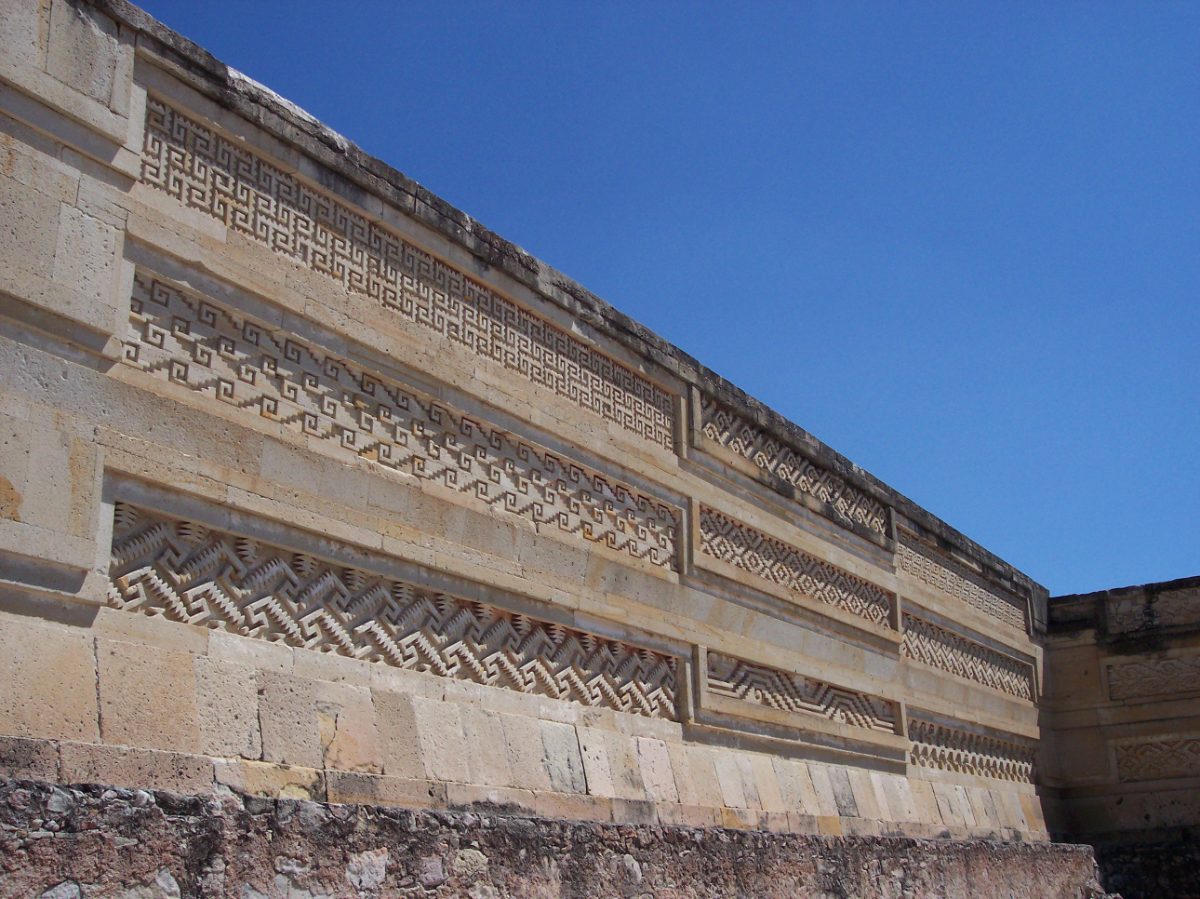 Close detail of geometric mosaic stonework on a wall at Mitla