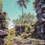 Nan Madol basalt walls rising above tropical vegetation