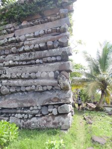 Close view of interlocked columnar basalt logs at Nan Madol