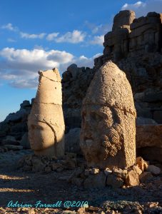 Toppled stone heads resting before their headless bodies at Nemrut