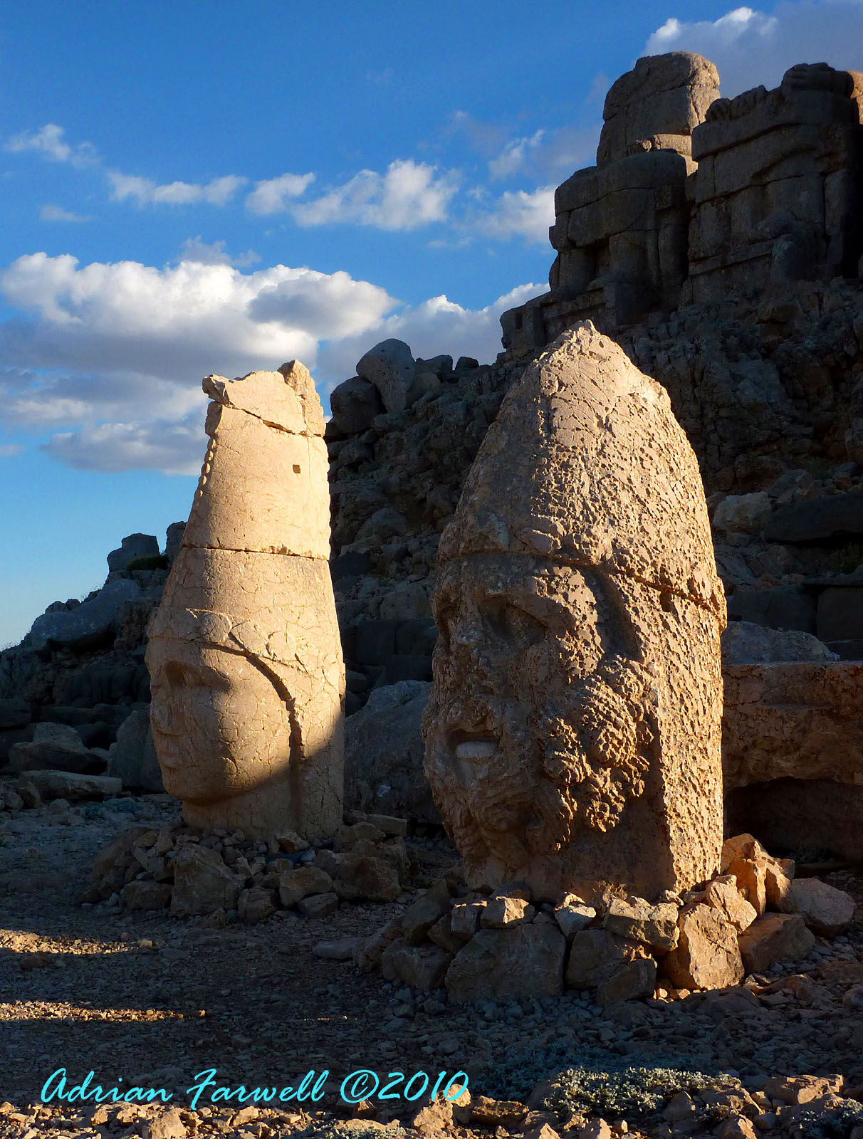 Toppled stone heads resting before their headless bodies at Nemrut