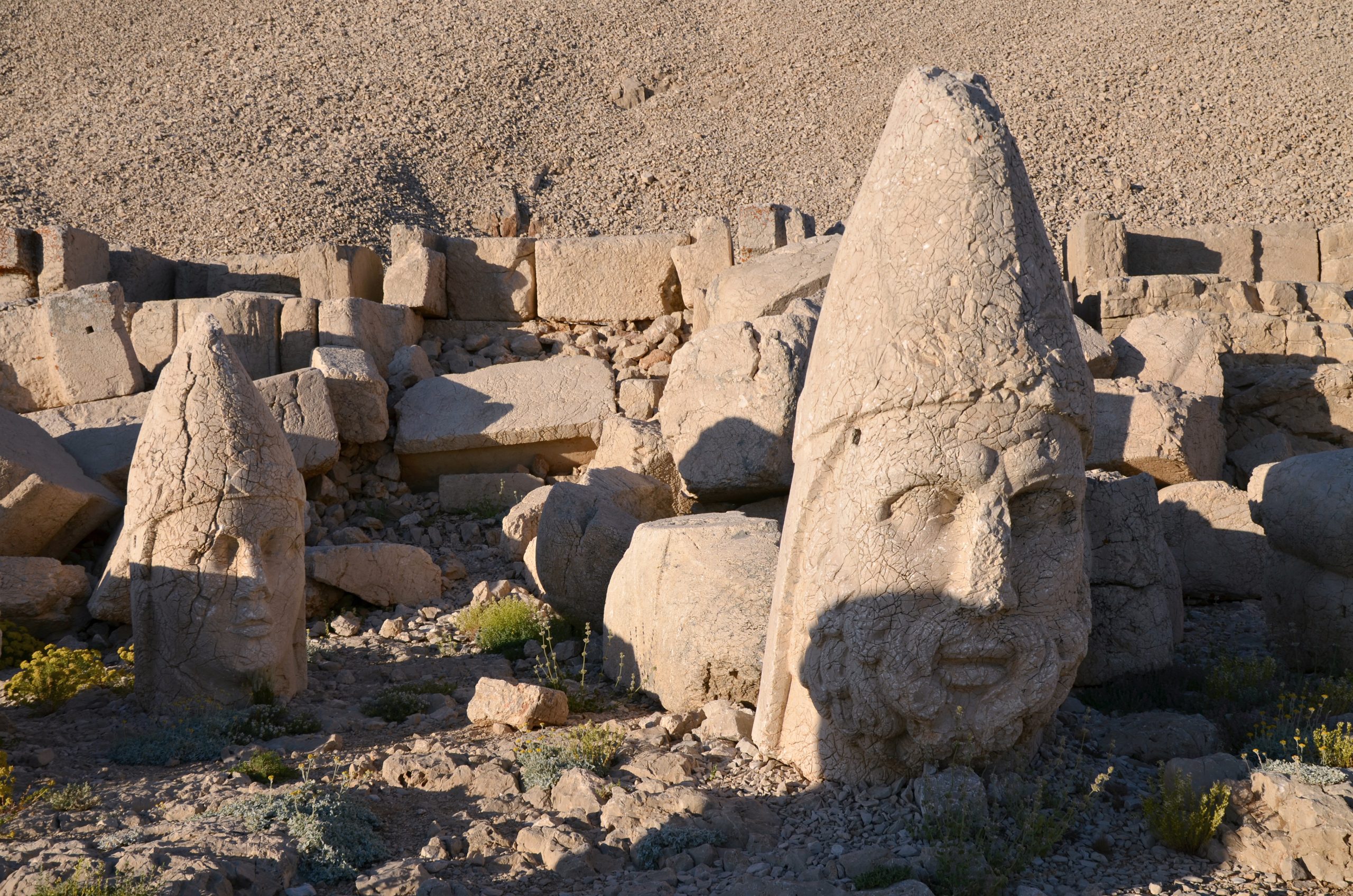 The huge heads of Antiochus I and Zeus lying on the terrace