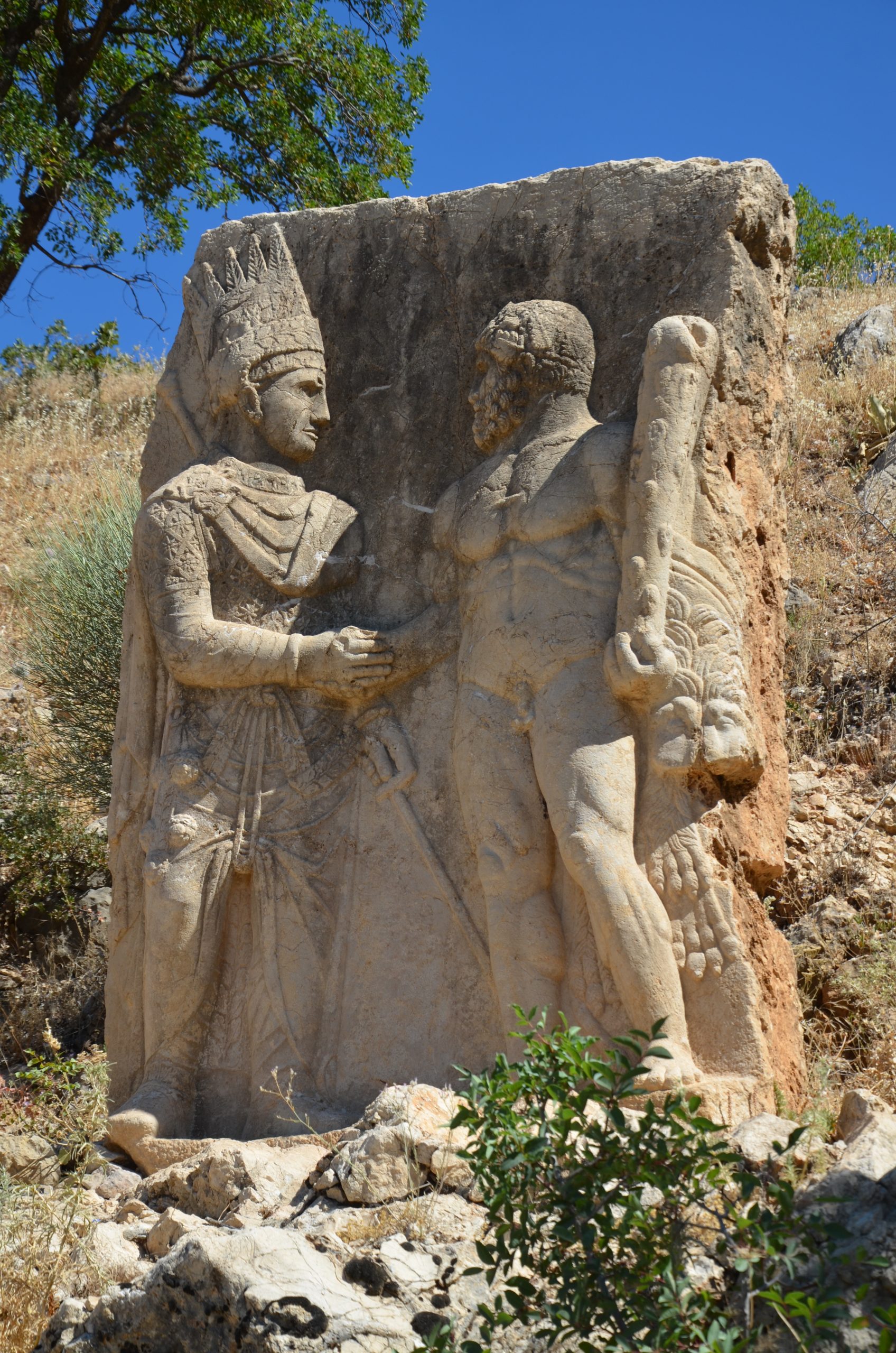 A relief of King Antiochus I clasping hands with a god at Arsameia