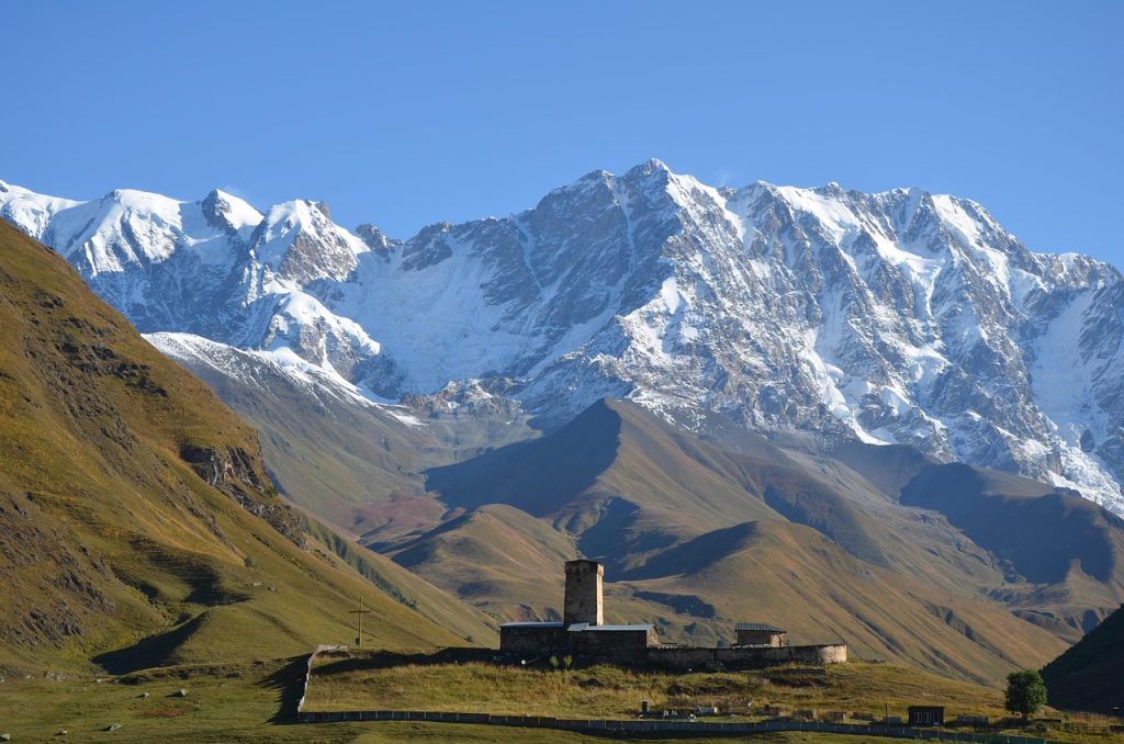 A tower and church, symbols of the layered Ossetian faith