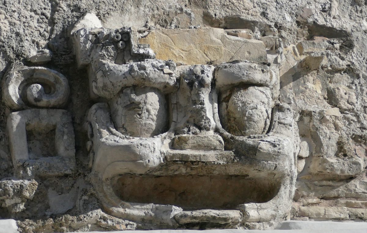 A carved stone mask at El Palacio, Palenque