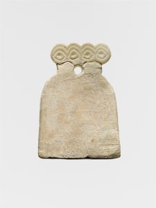 A single alabaster eye idol from Tell Brak, its wide eyes gazing out across five thousand years