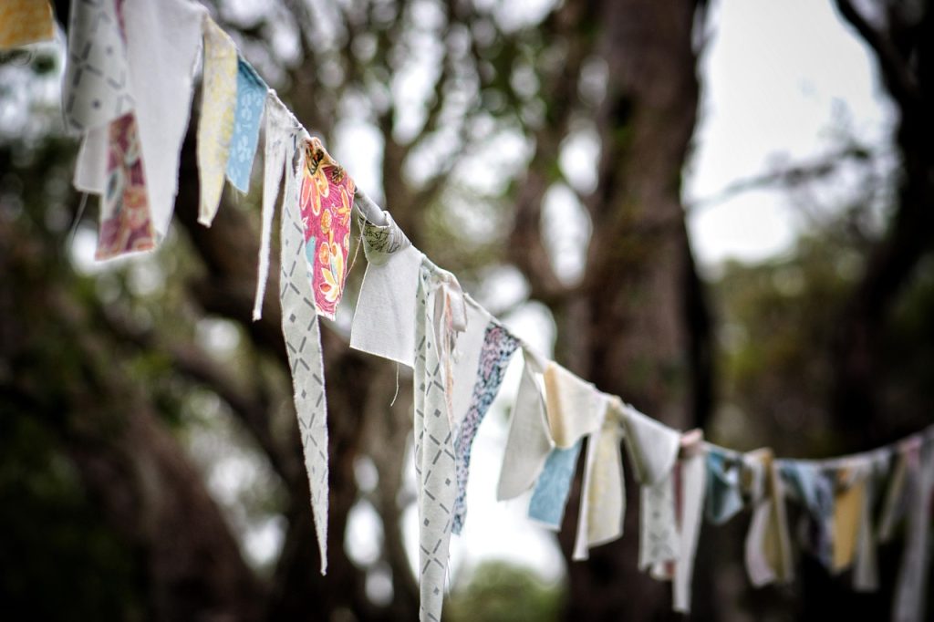 Prayer flags printed with the Tibetan script that carries the language and its scriptures.