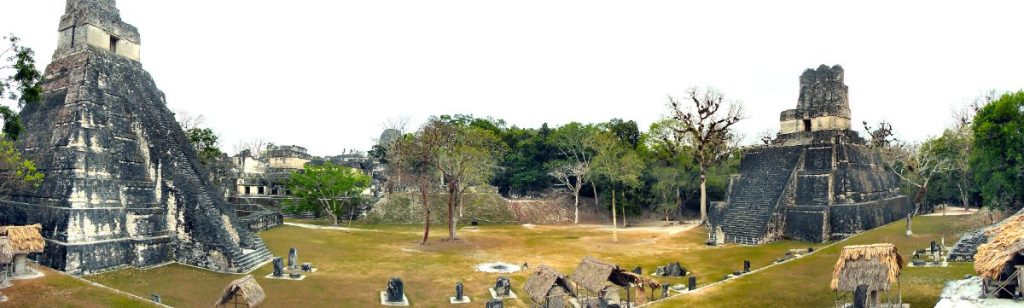 Panoramic view of the Great Plaza at Tikal with Temple I and Temple II in Guatemala