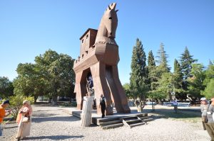 Ruins and reconstructed wooden horse at the Troy archaeological site