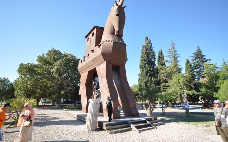 Ruins and reconstructed wooden horse at the Troy archaeological site
