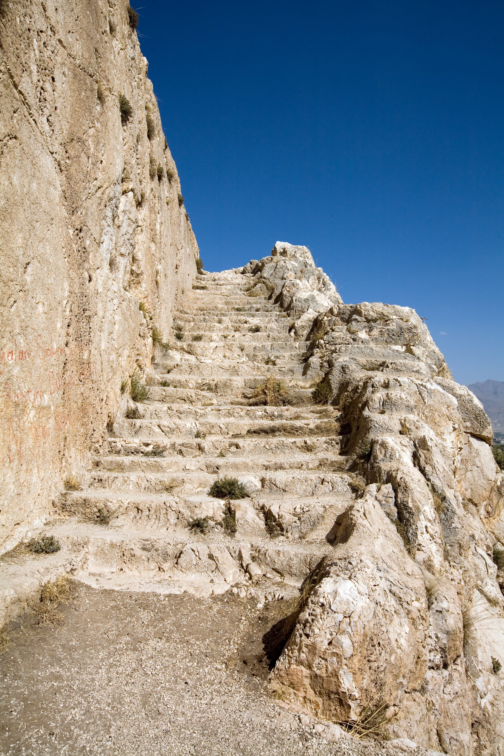 Rock-cut stairs climbing the citadel of ancient Tushpa