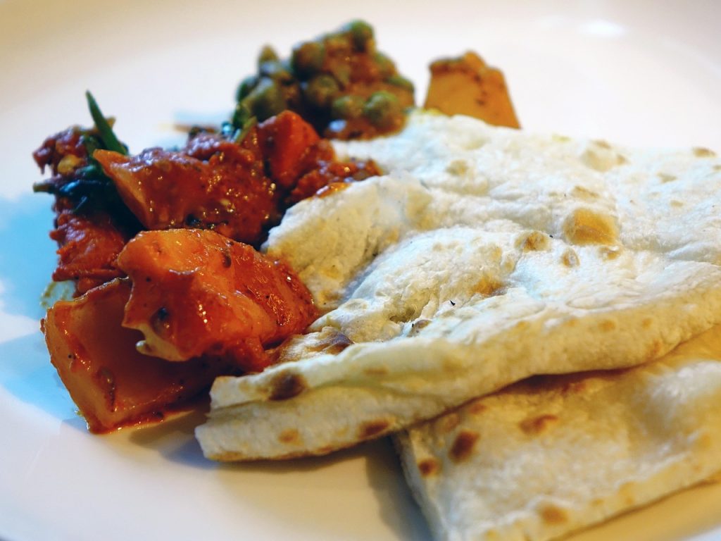 Naan bread, hand-pulled noodles, and pilaf define the Uyghur table.