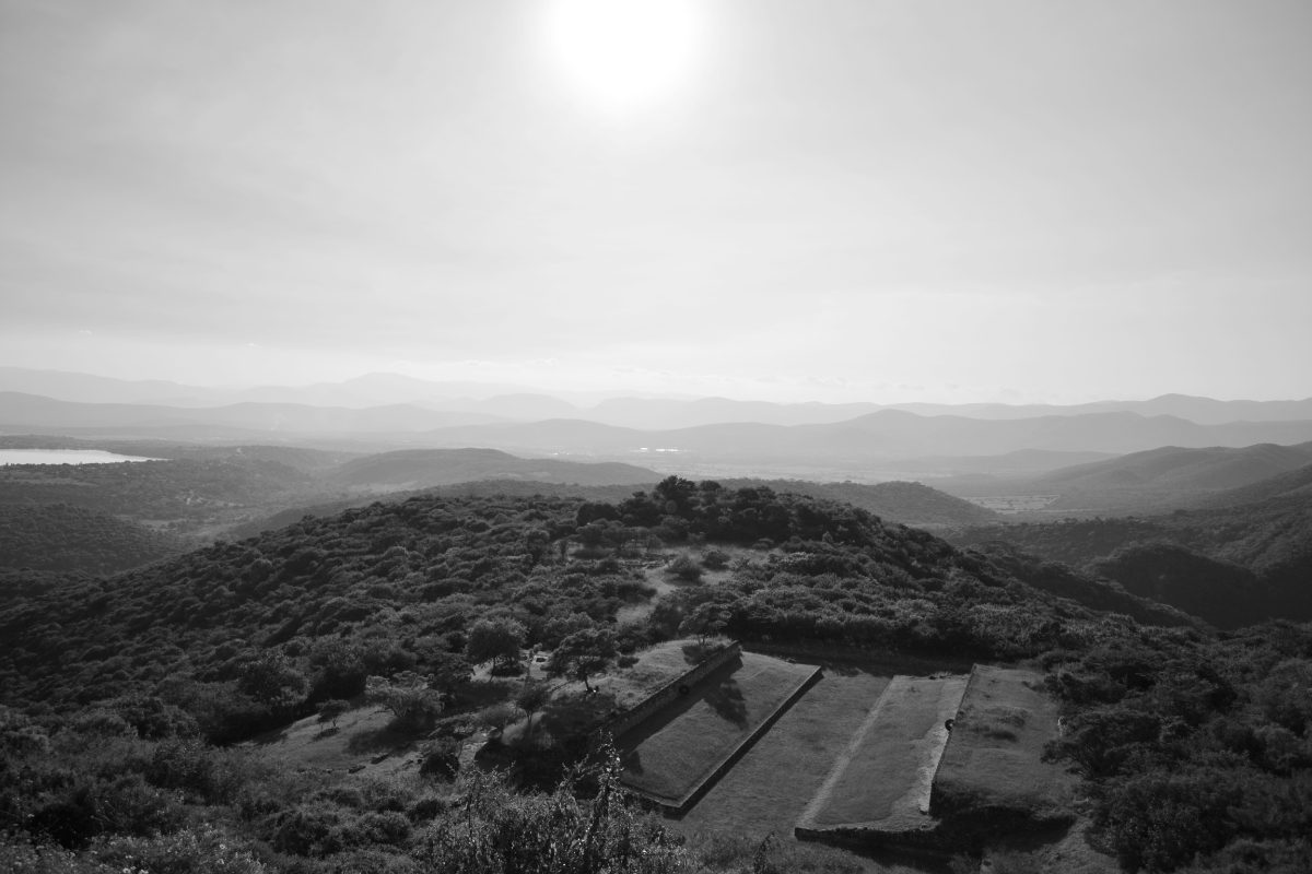 View of stone terraces and structures on the hilltop site of Xochicalco