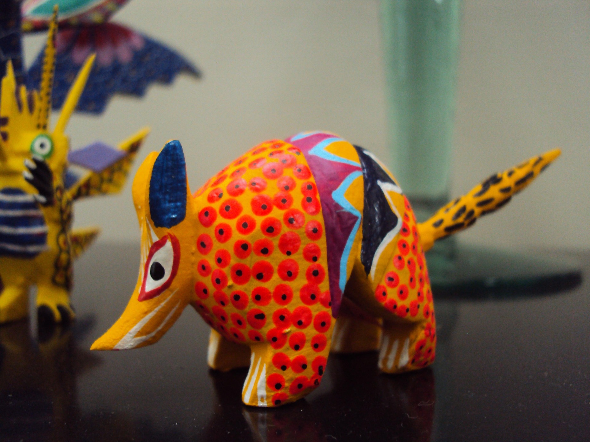 An alebrije, the brightly painted carved creature born from Oaxacan artistry