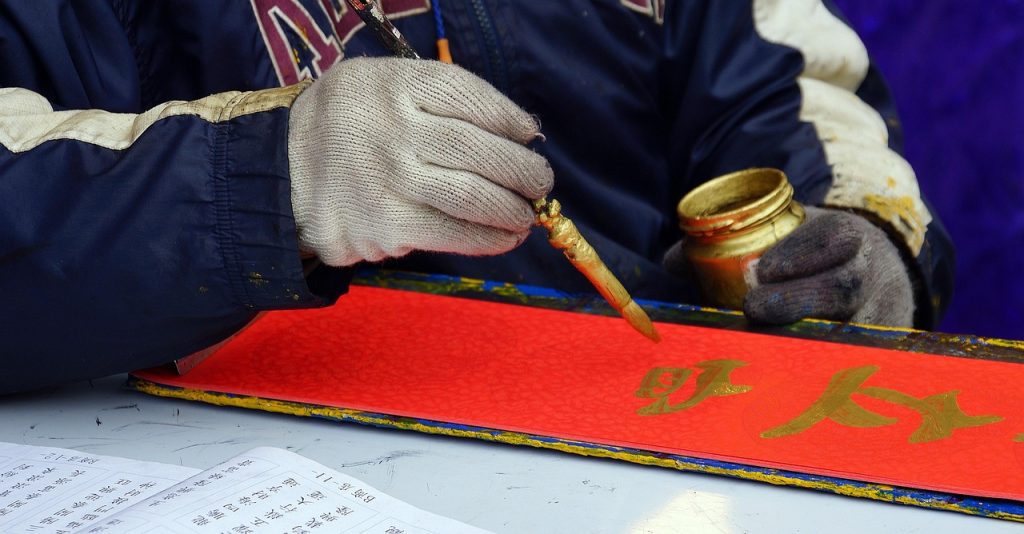 Zhuang is a Tai language, once written with home-made characters, now in a Latin script.