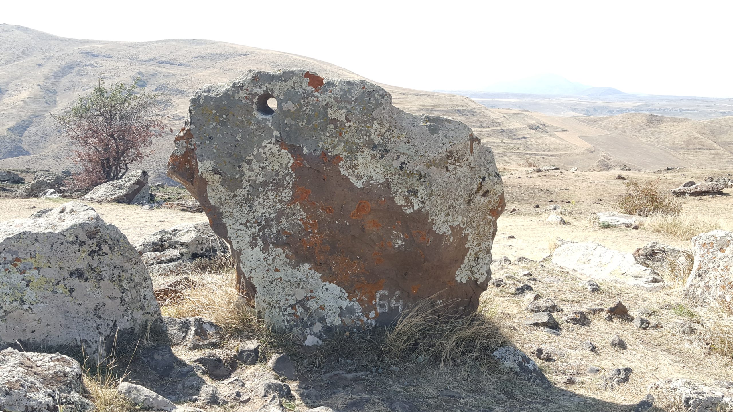 A basalt standing stone at Zorats Karer pierced by a smooth bored hole